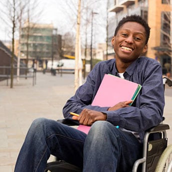 A student smiling on campus